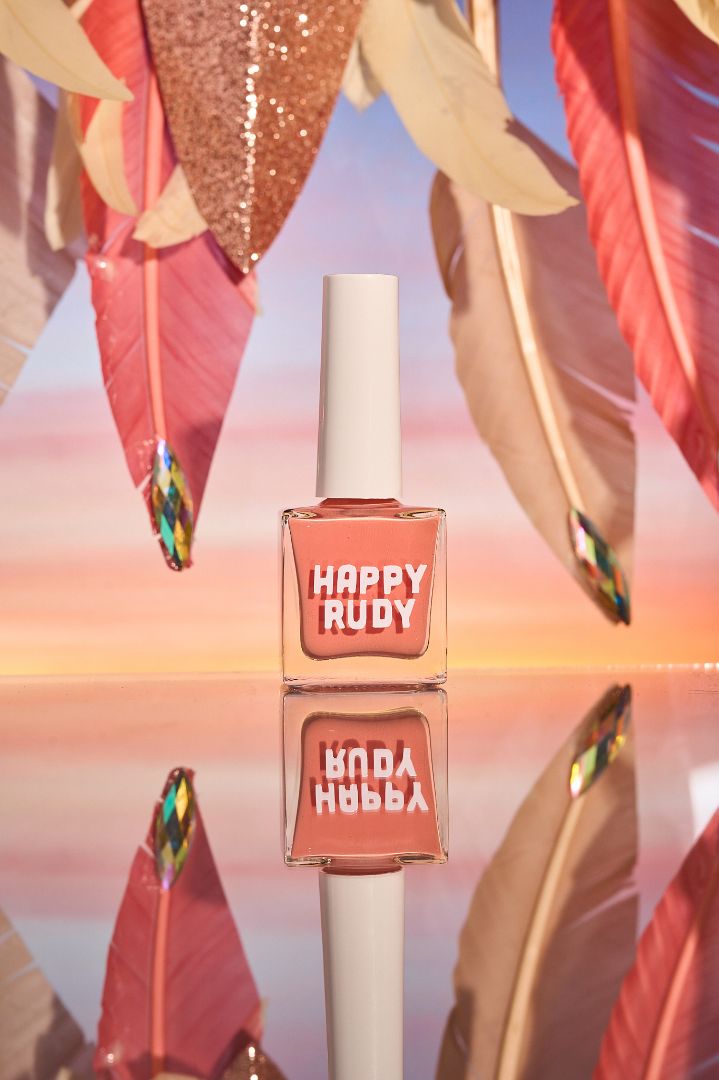 Pink coral crème nail polish inspired by the vibrant spirit of Caribbean Carnival, from the Masquerade Collection.