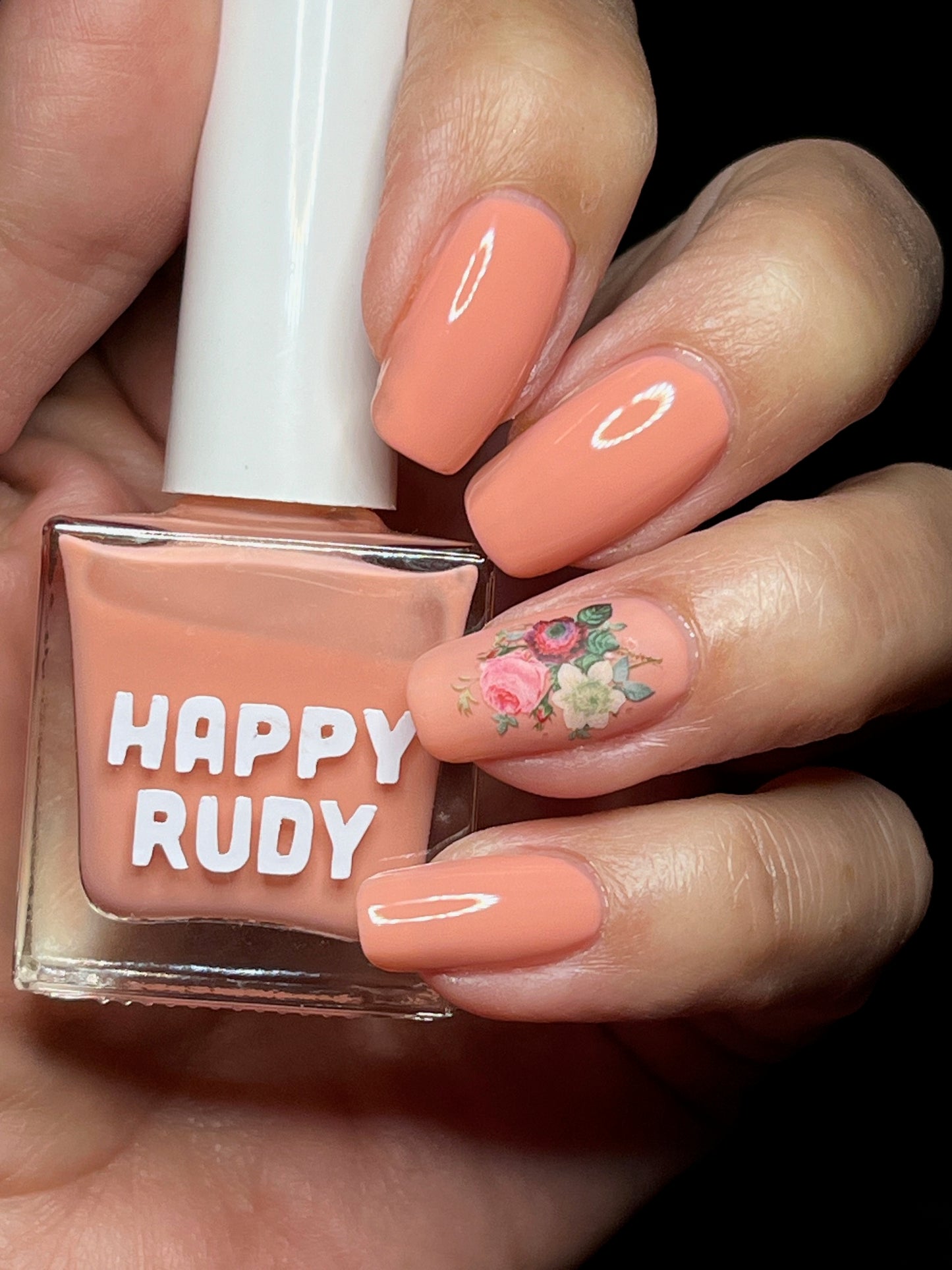 Pink coral crème nail polish inspired by the vibrant spirit of Caribbean Carnival, from the Masquerade Collection.