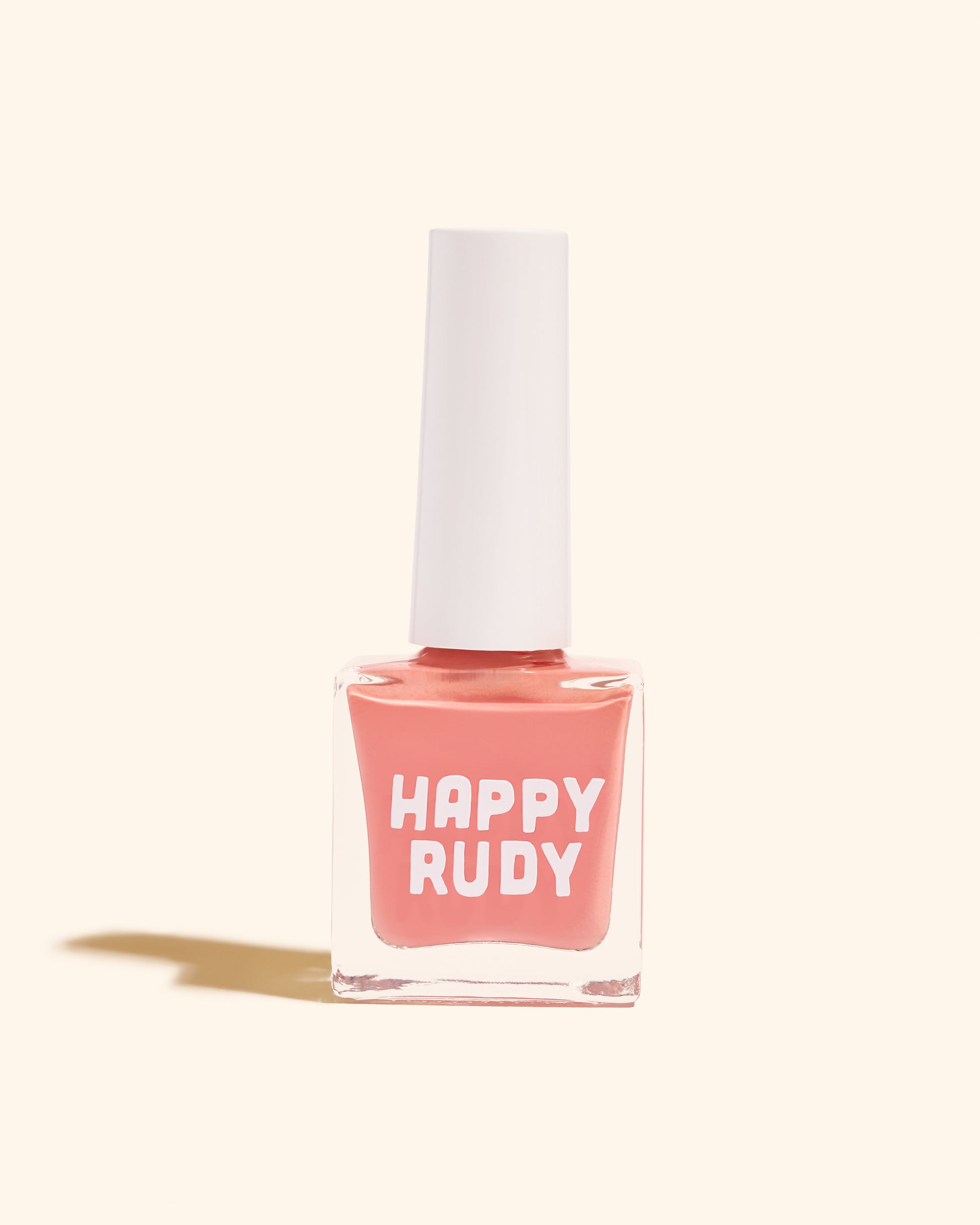 Pink coral crème nail polish inspired by the vibrant spirit of Caribbean Carnival, from the Masquerade Collection.