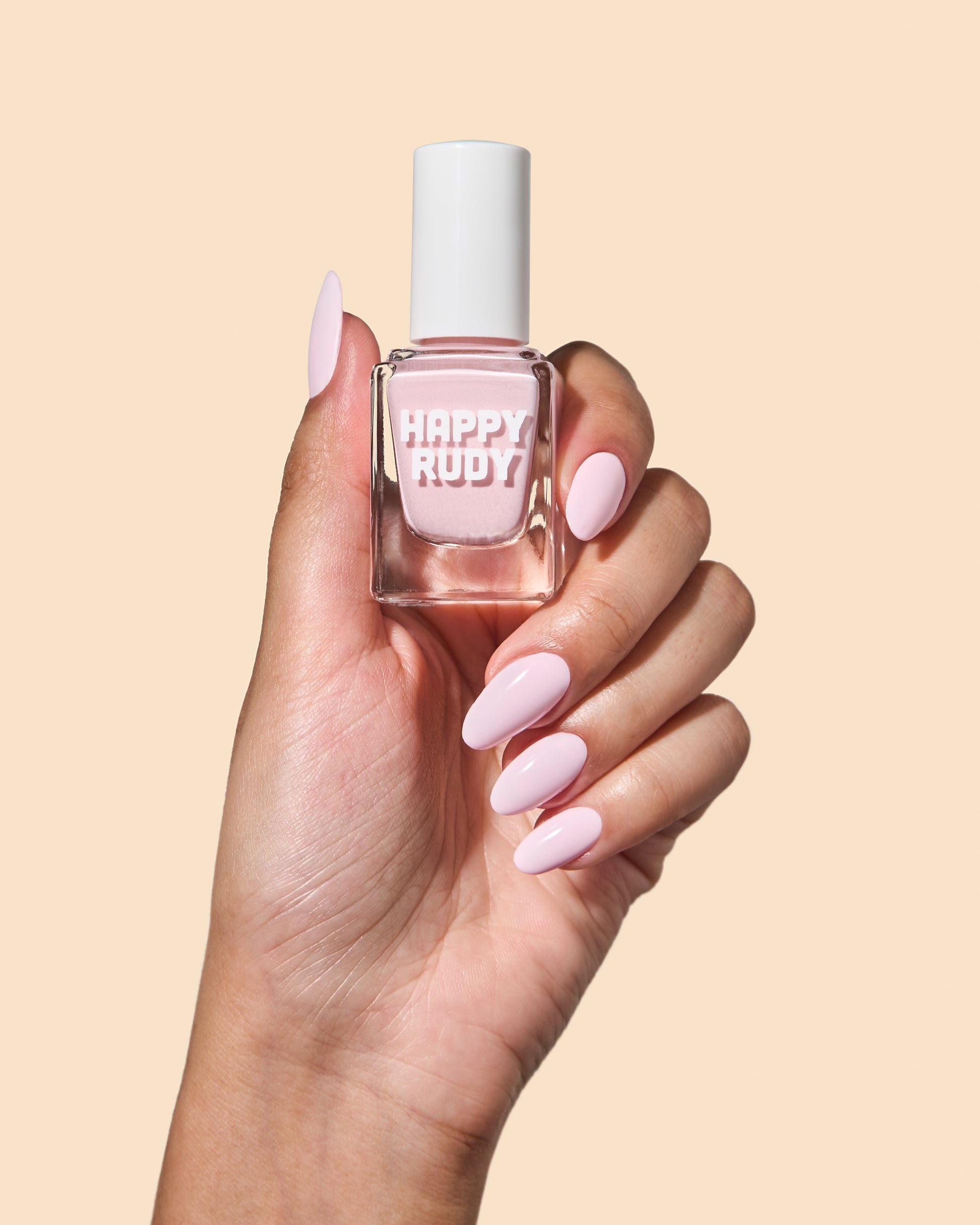 Milky baby pink crème nail polish perfect for vibrant spring nails.