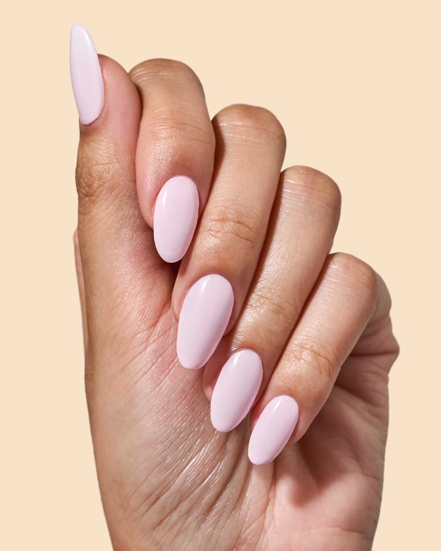 Milky baby pink crème nail polish perfect for vibrant spring nails.