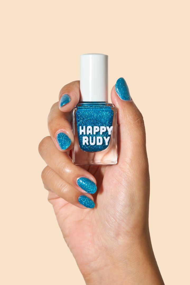 Sparkling blue glitter nail polish inspired by holiday magic, from the Screen and Sparkles collection.