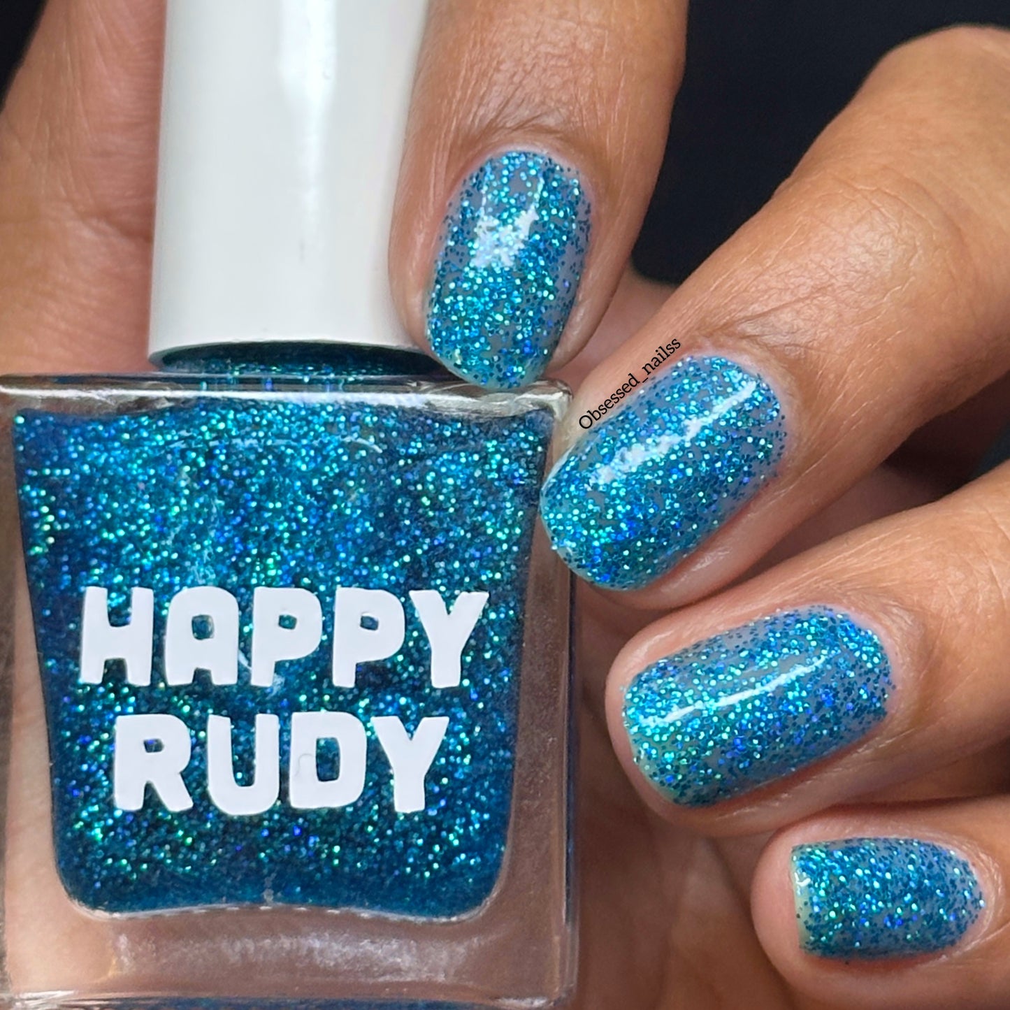 Sparkling blue glitter nail polish inspired by holiday magic, from the Screen and Sparkles collection.
