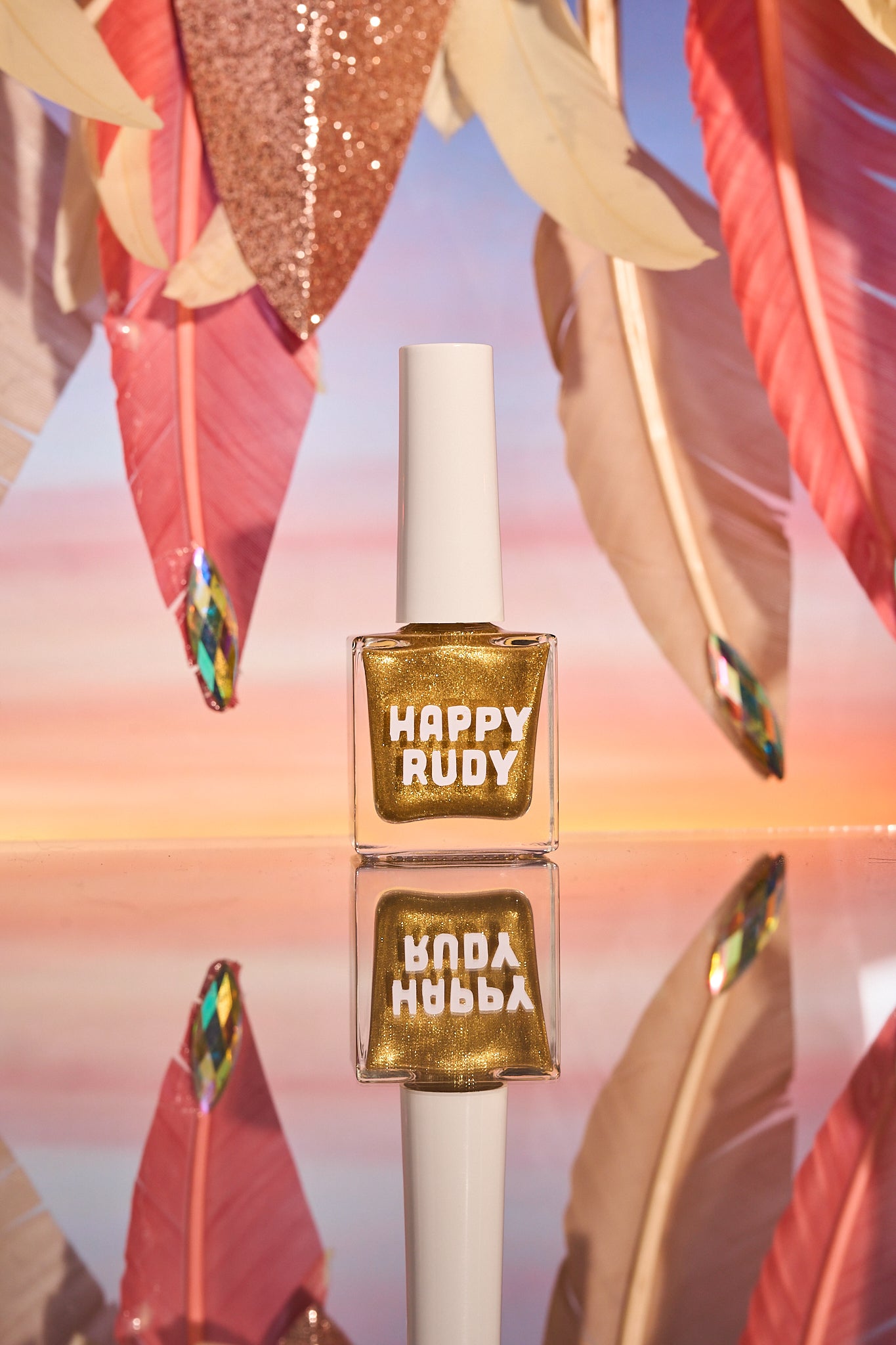 Radiant gold glitter nail polish with eco-friendly sparkle, inspired by Caribbean celebration, from the Masquerade Collection.