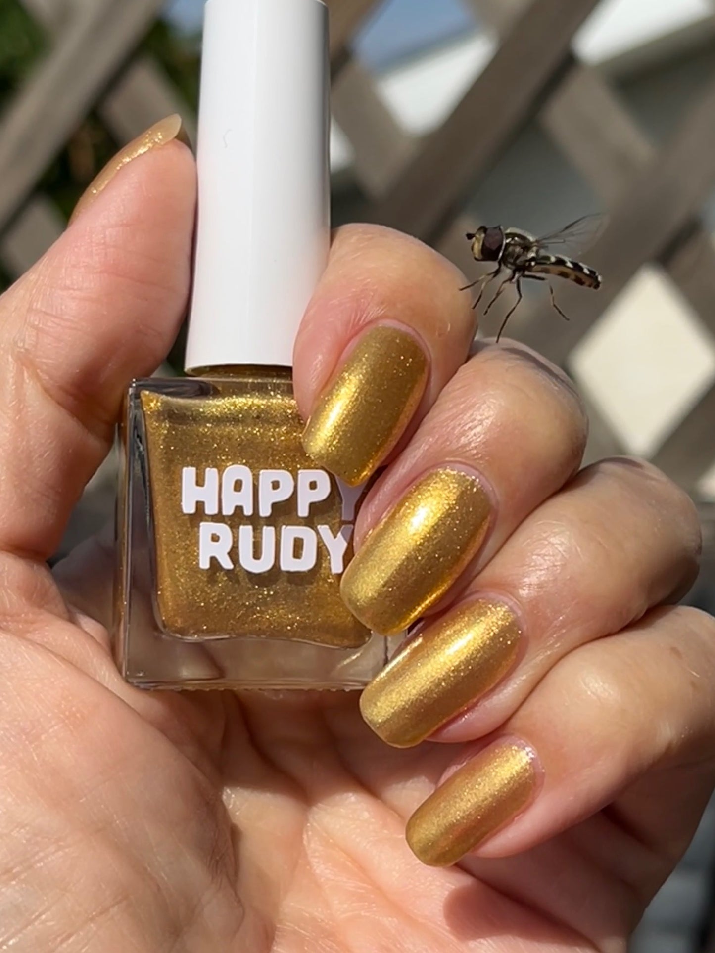 Radiant gold glitter nail polish with eco-friendly sparkle, inspired by Caribbean celebration, from the Masquerade Collection.