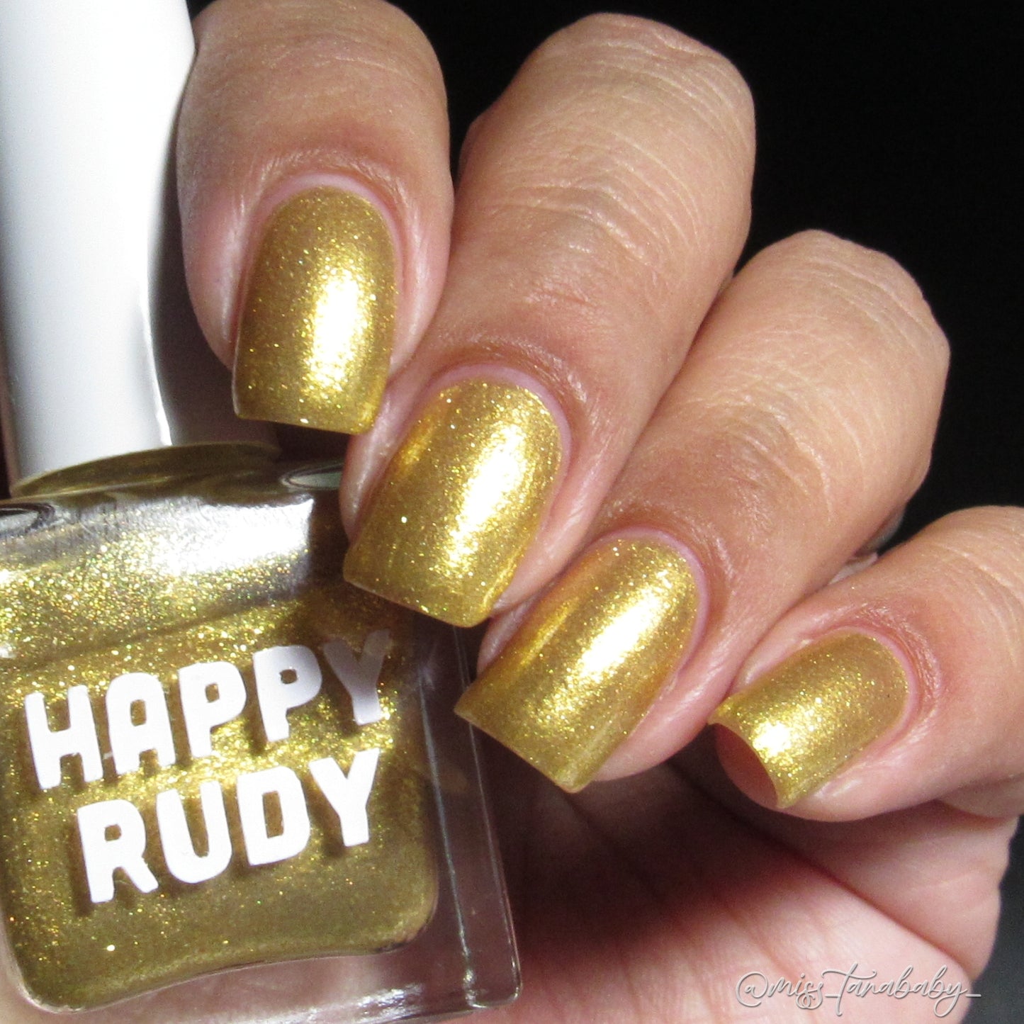 Radiant gold glitter nail polish with eco-friendly sparkle, inspired by Caribbean celebration, from the Masquerade Collection.
