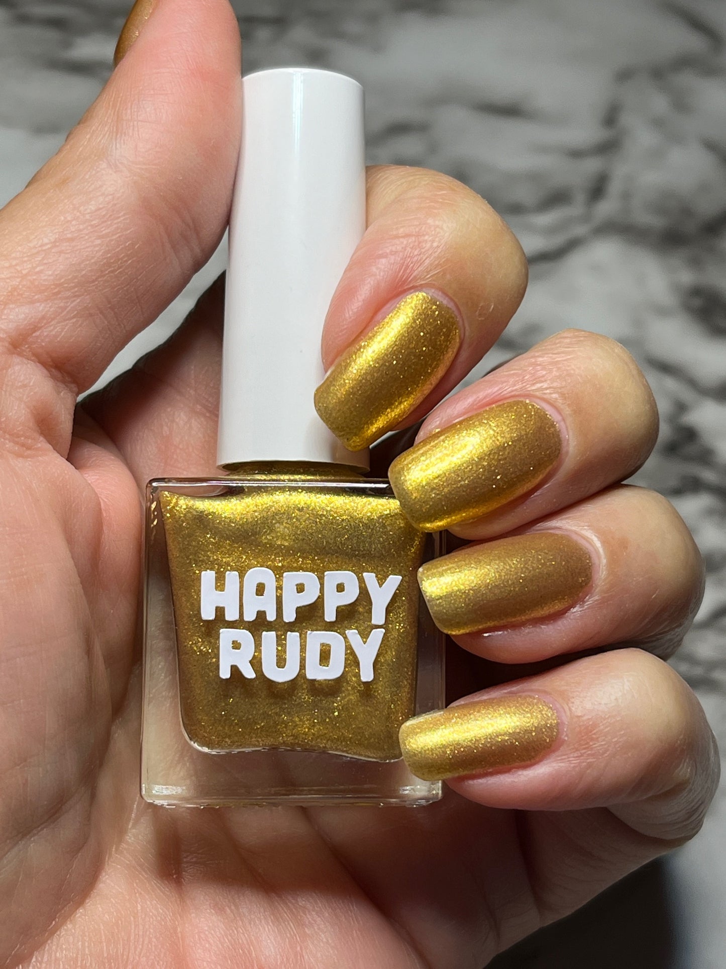 Radiant gold glitter nail polish with eco-friendly sparkle, inspired by Caribbean celebration, from the Masquerade Collection.