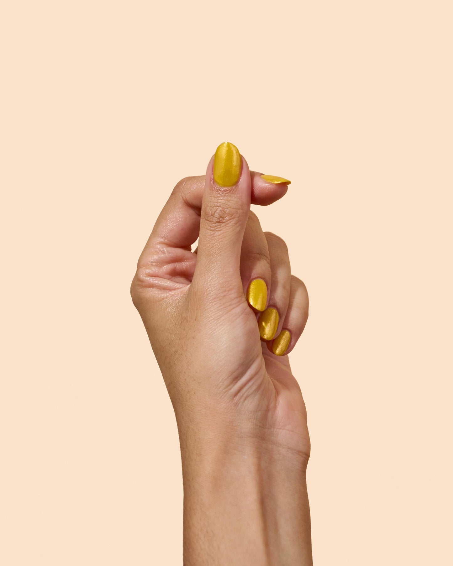 Yellow shimmer nail polish with radiant finish, inspired by '70s dance floors, from the Studio 54 Collection.