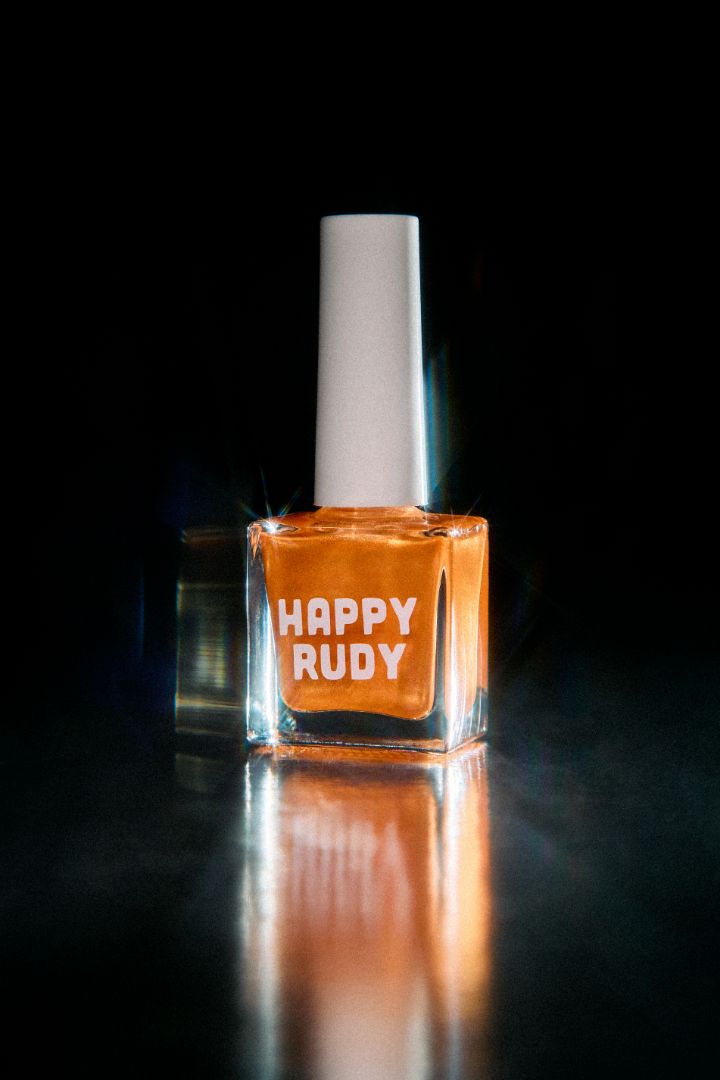 Orange copper shimmer nail polish with bold retro energy, from the Studio 54 Collection.
