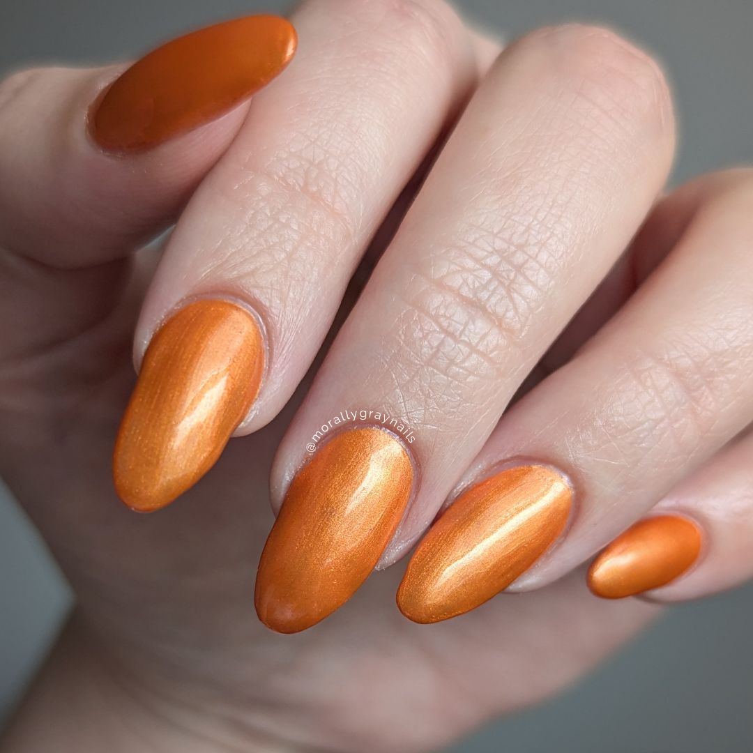 Orange copper shimmer nail polish with bold retro energy, from the Studio 54 Collection.