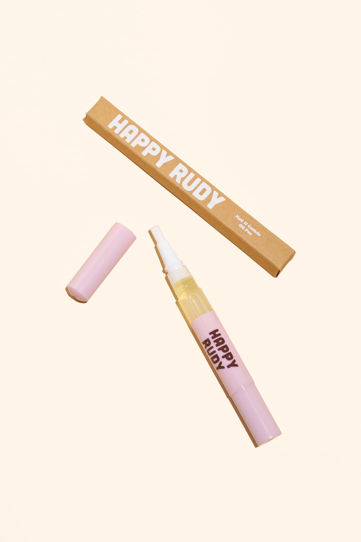 Nail oil pen for nourishing cuticles and hydrating nails by Happy Rudy. Lightweight, travel-friendly, and made with clean ingredients.