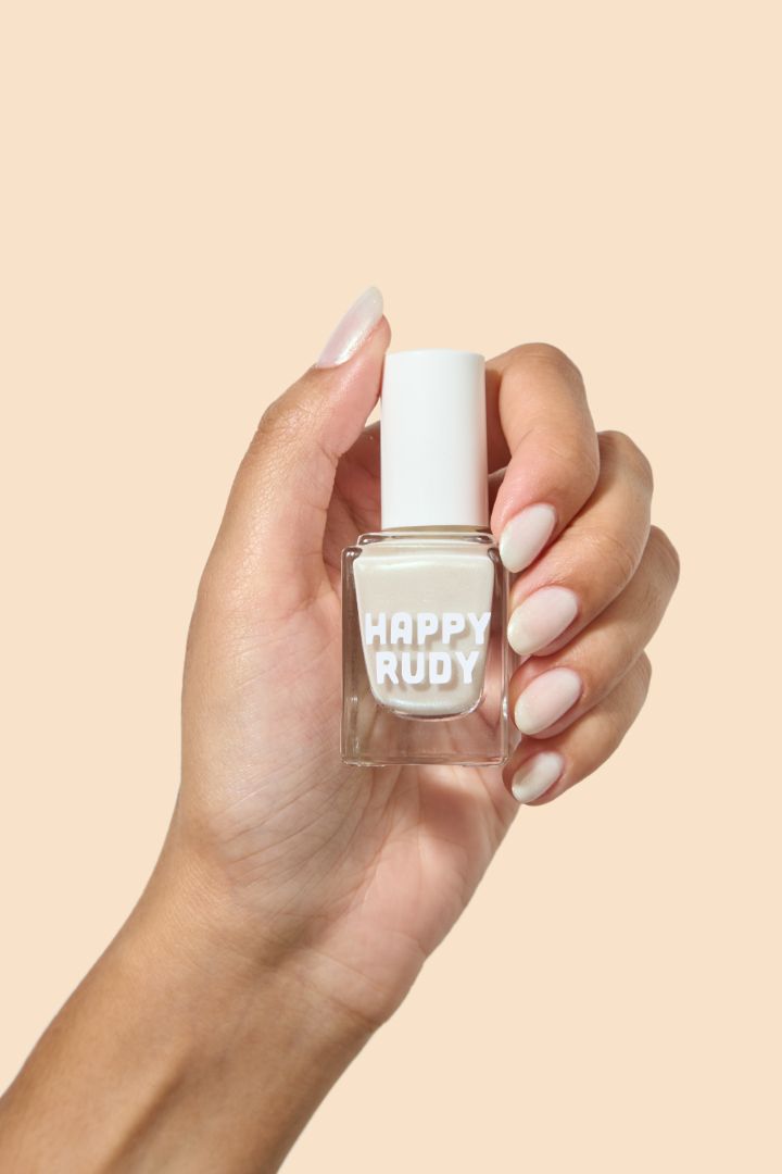 White shimmer nail polish with a soft gold glow from the Screen and Sparkles collection