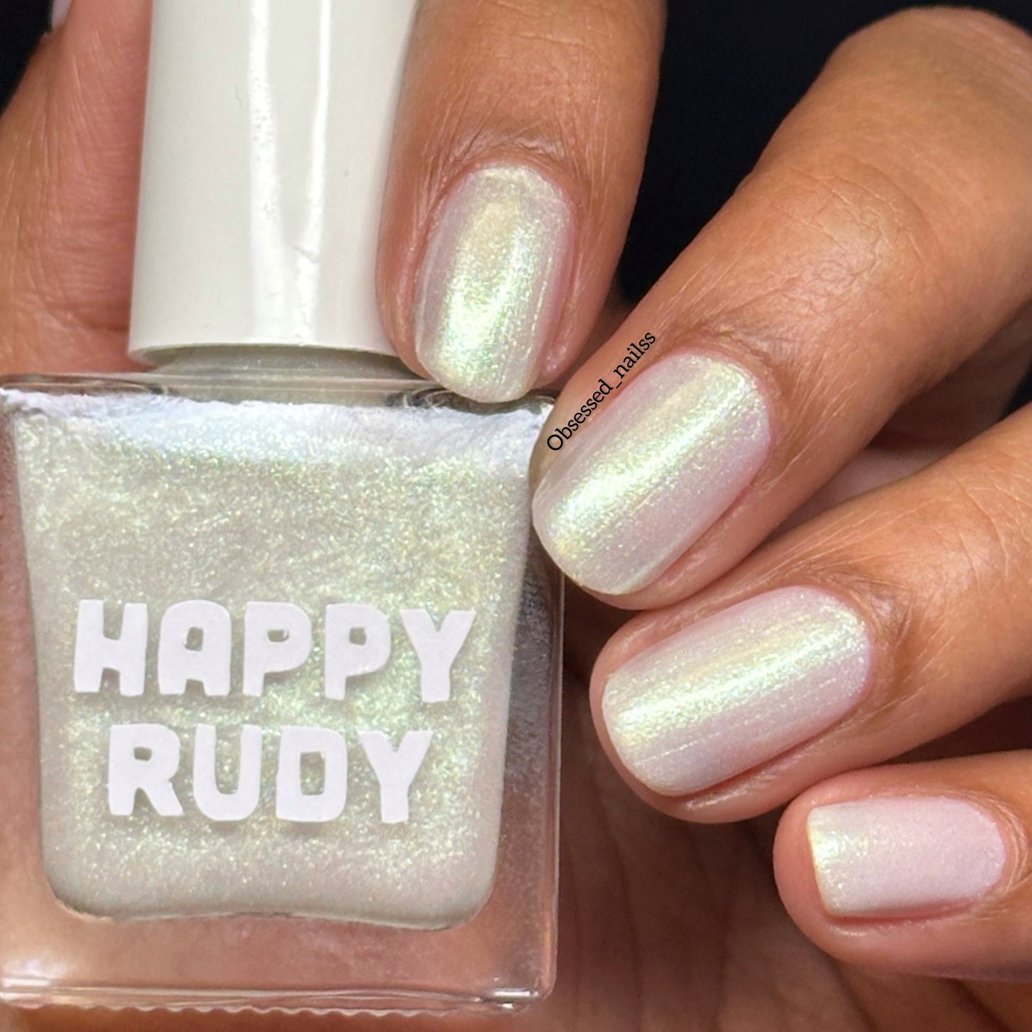 White shimmer nail polish with a soft gold glow from the Screen and Sparkles collection.