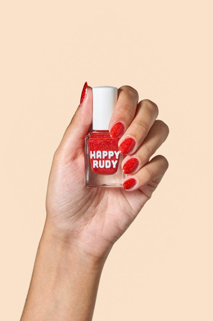 Bold ruby red glitter nail polish perfect for festive looks, part of the Screen and Sparkles collection.