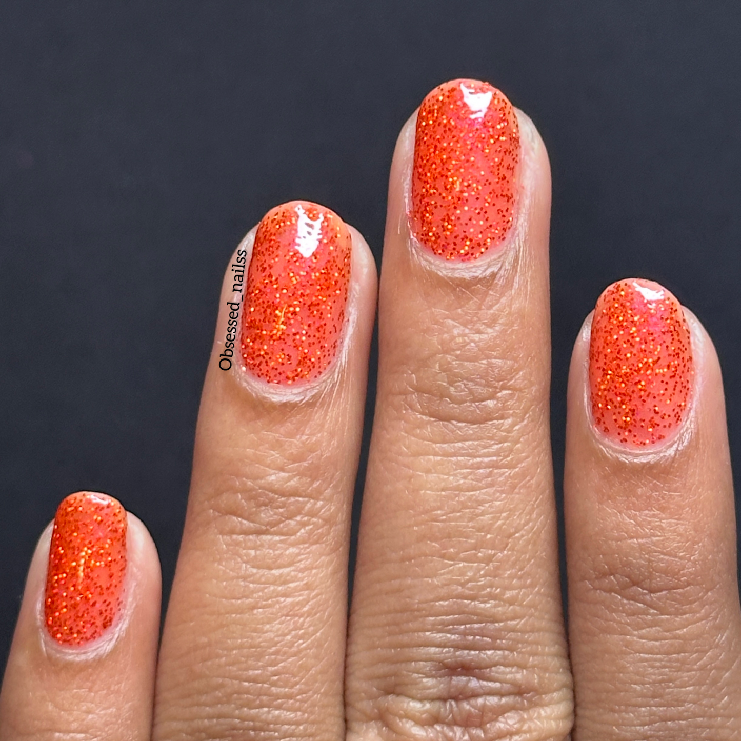 Bold ruby red glitter nail polish perfect for festive looks, part of the Screen and Sparkles collection.