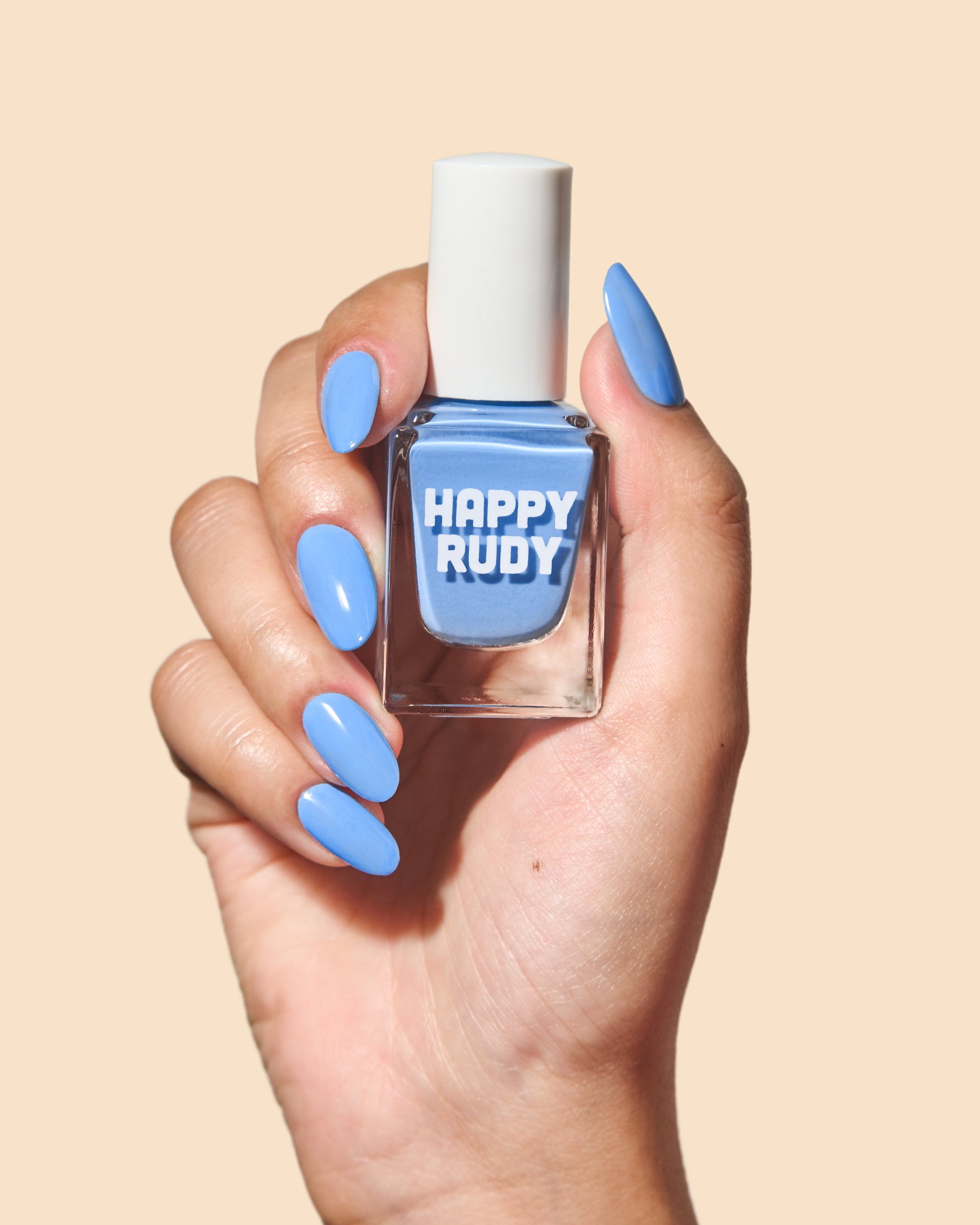 Bold cornflower blue crème nail polish for vibrant spring nails.