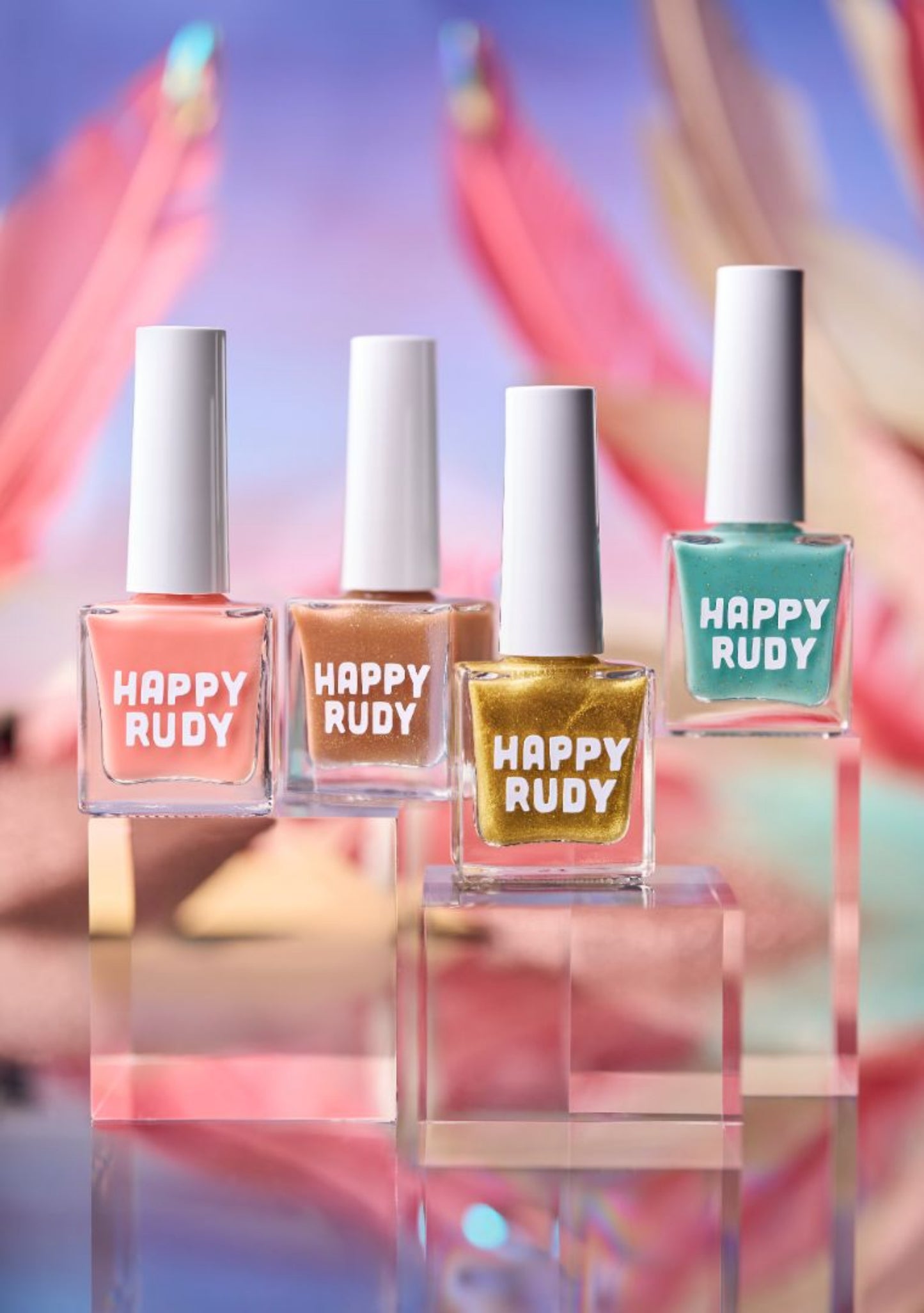 Group shot of the Masquerade Collection featuring vibrant glitter and crème shades inspired by Caribbean Carnival.