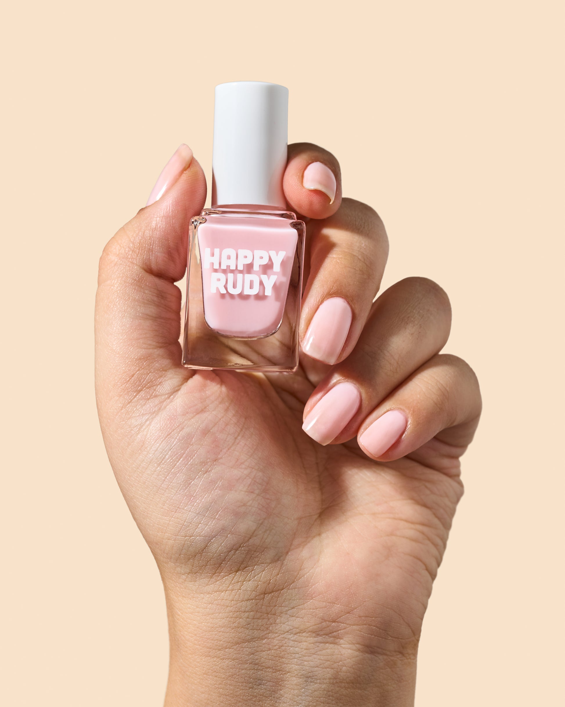 Sheer pink jelly nail polish with a high-gloss finish.