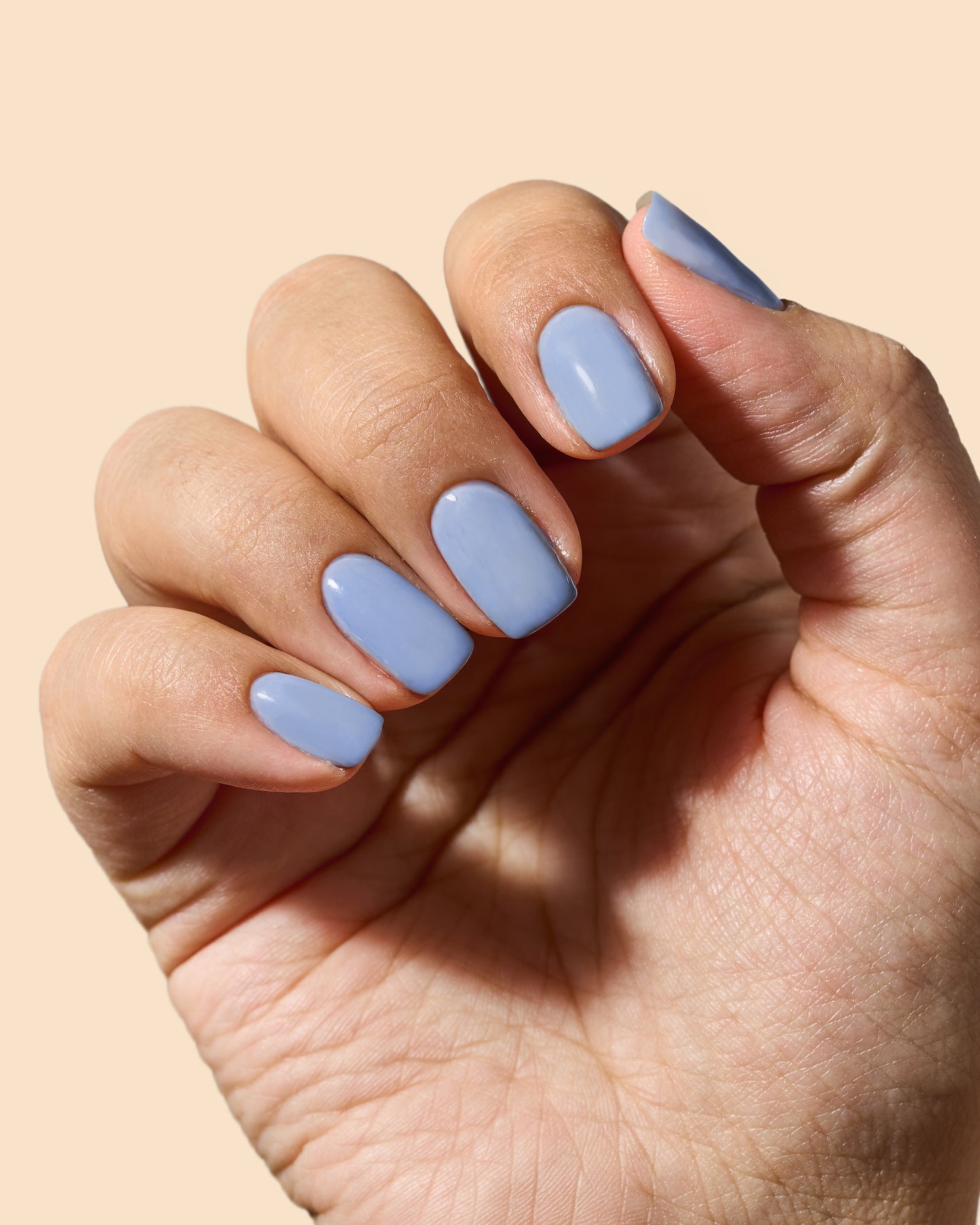 Cornflower blue jelly nail polish with a sheer, shiny finish