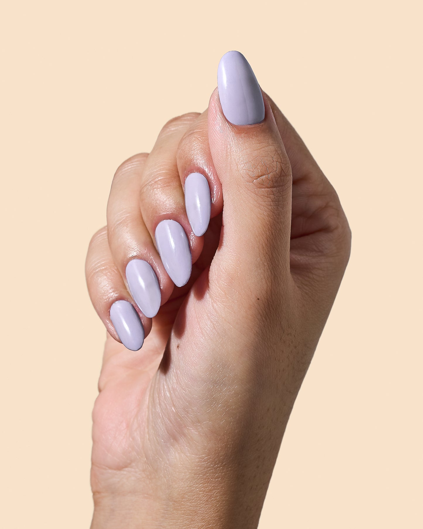 Lavender crème nail polish designed for calm, polished looks.