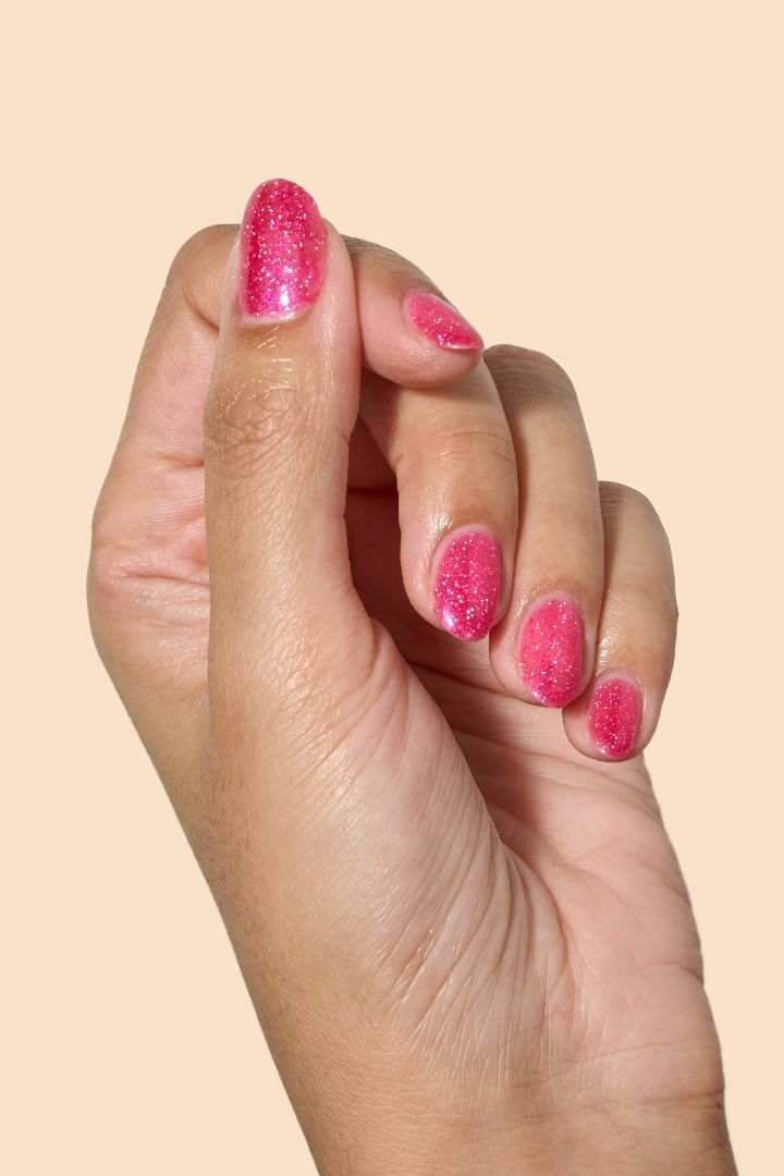 Vibrant pink glitter nail polish with eco-friendly sparkle from the Screen and Sparkles collection.