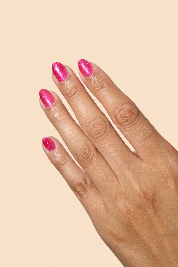Vibrant pink glitter nail polish with eco-friendly sparkle from the Screen and Sparkles collection.
