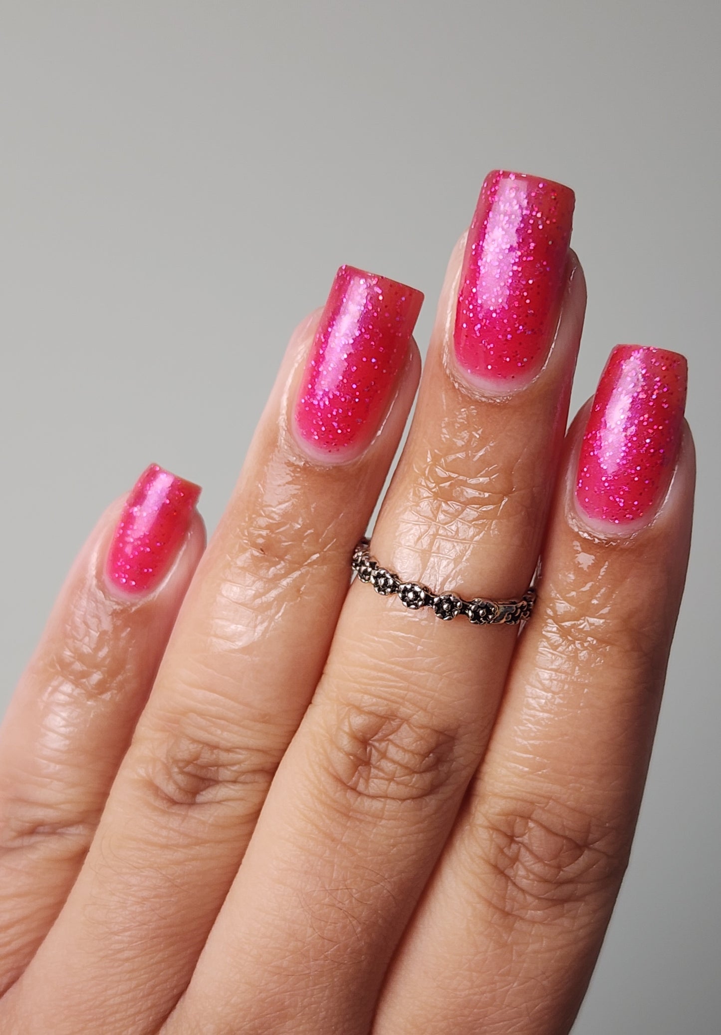 Vibrant pink glitter nail polish with eco-friendly sparkle from the Screen and Sparkles collection.