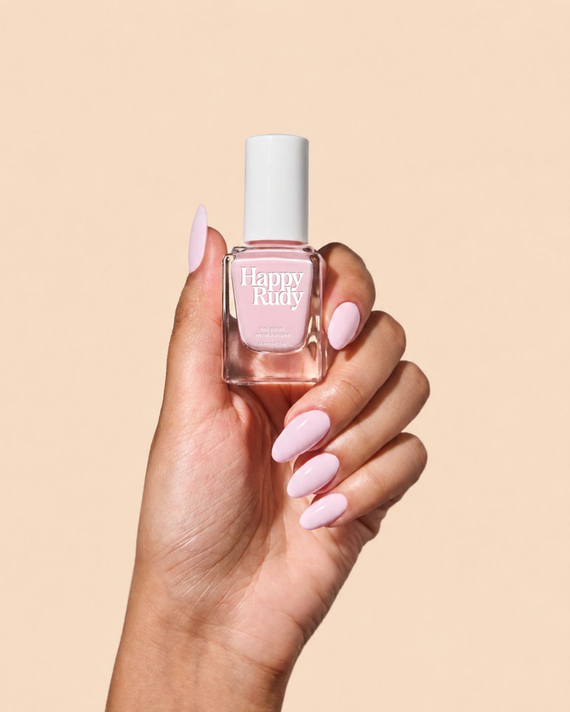 Milky baby pink crème nail polish perfect for vibrant spring nails.