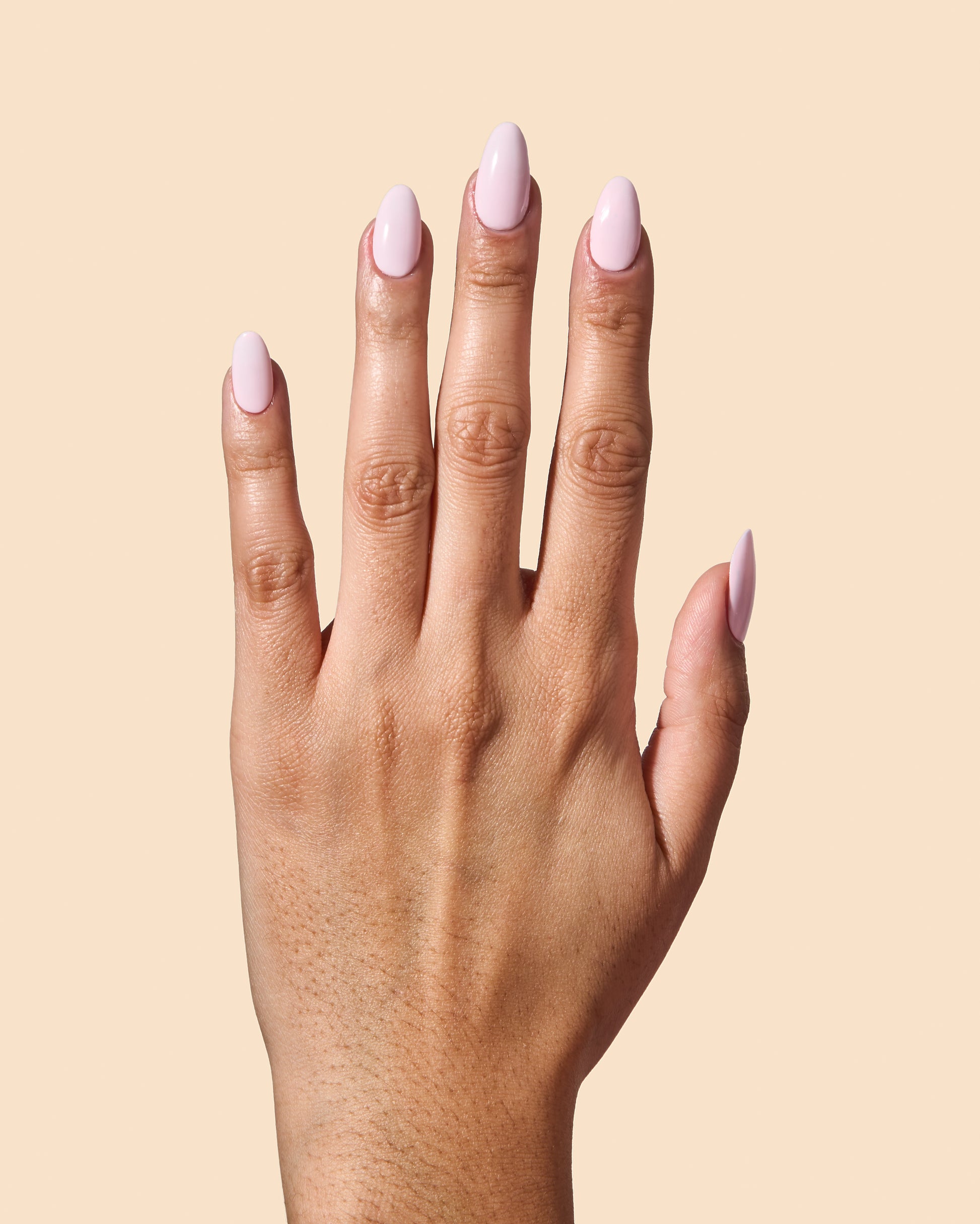 Milky baby pink crème nail polish perfect for vibrant spring nails.
