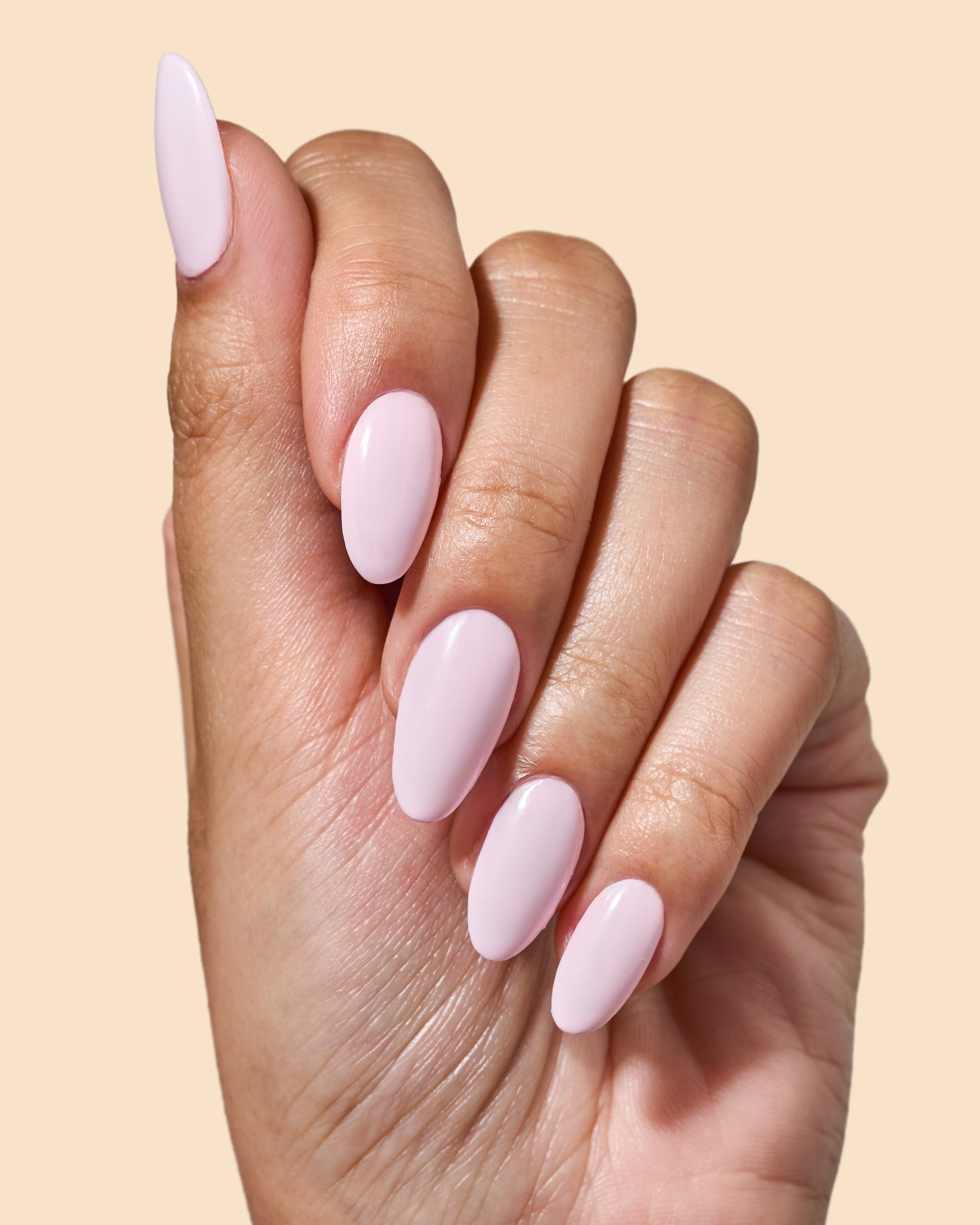 Milky baby pink crème nail polish perfect for vibrant spring nails.