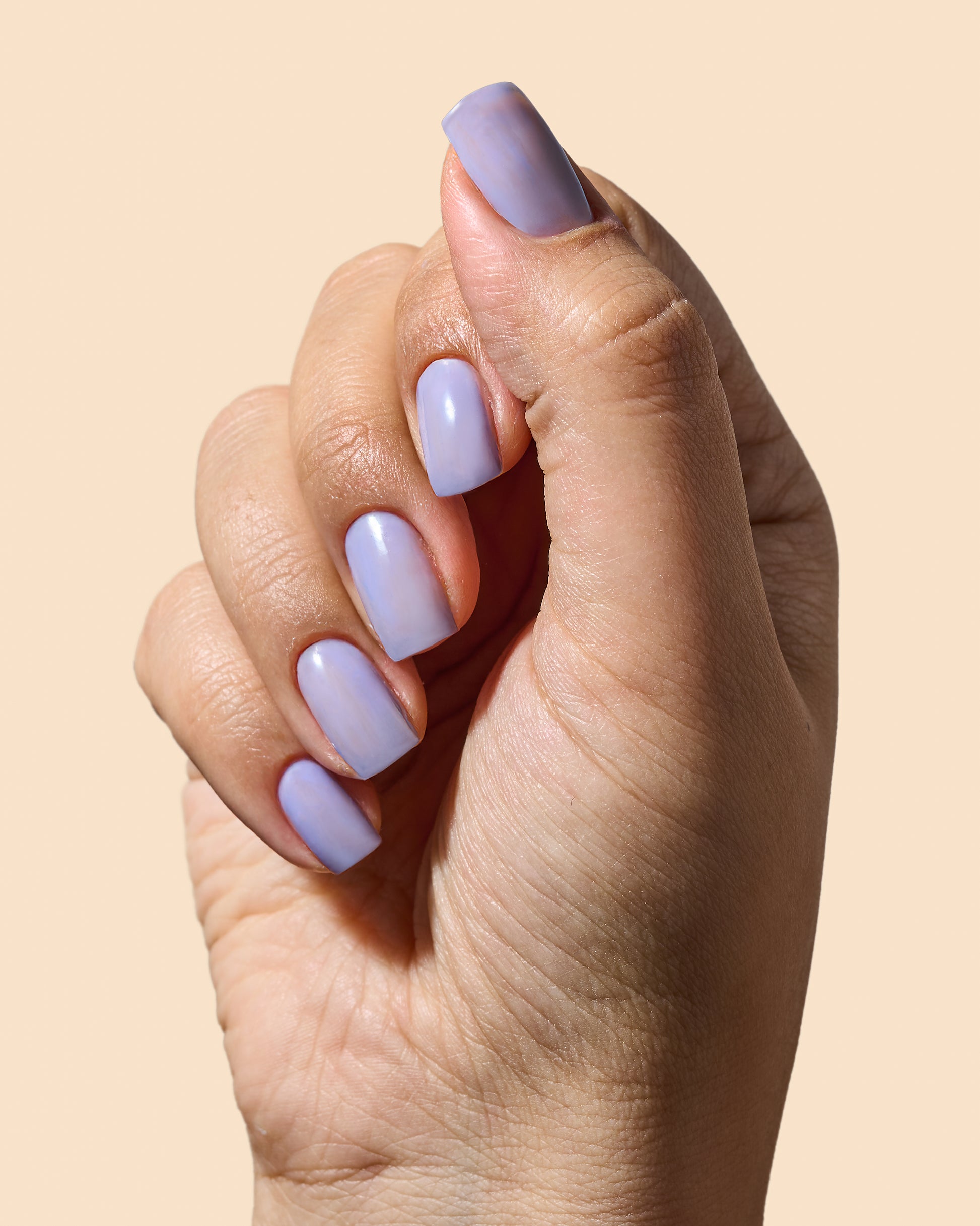 Glossy lavender jelly nail polish perfect for soft, sheer coverage.