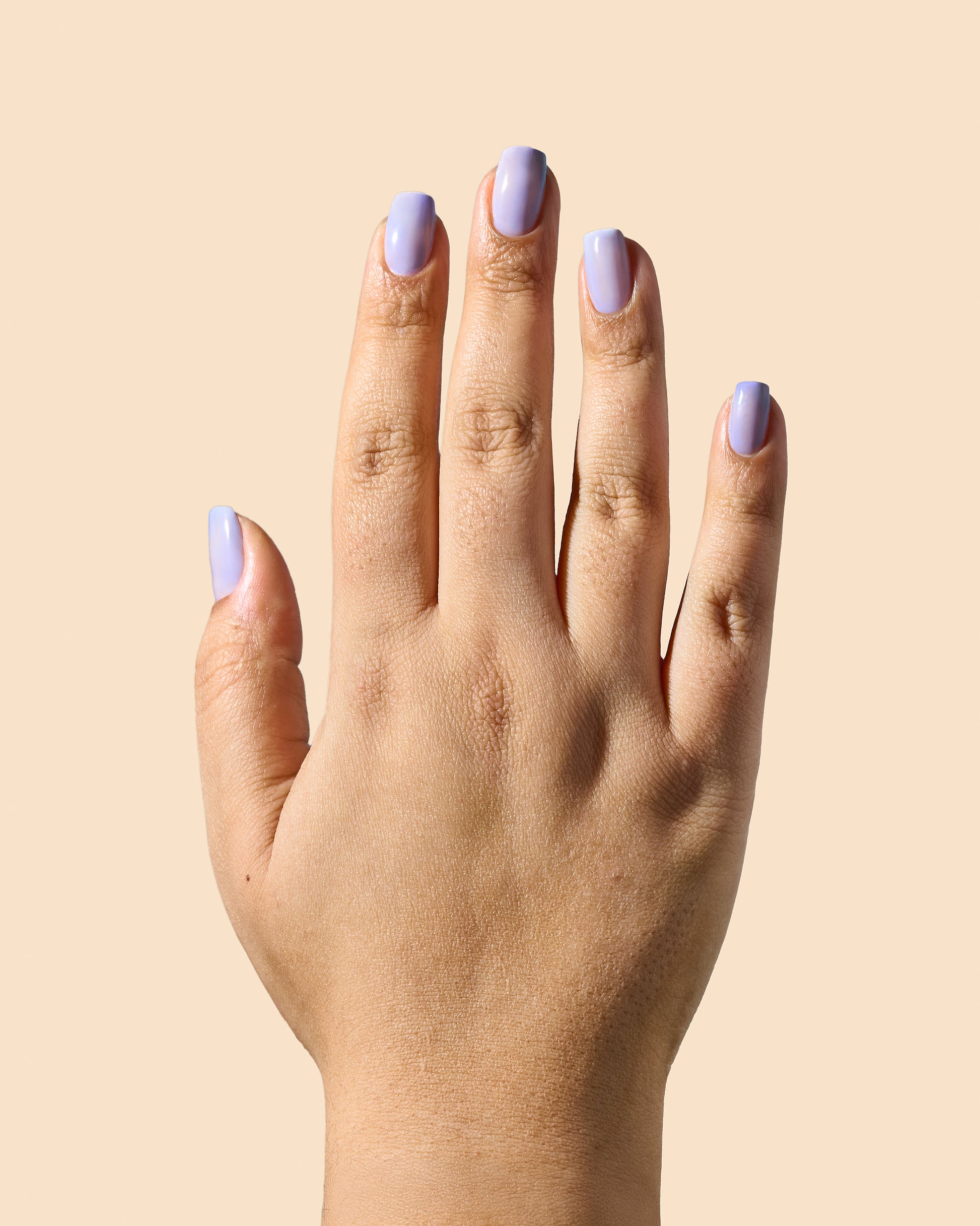 Glossy lavender jelly nail polish perfect for soft, sheer coverage.