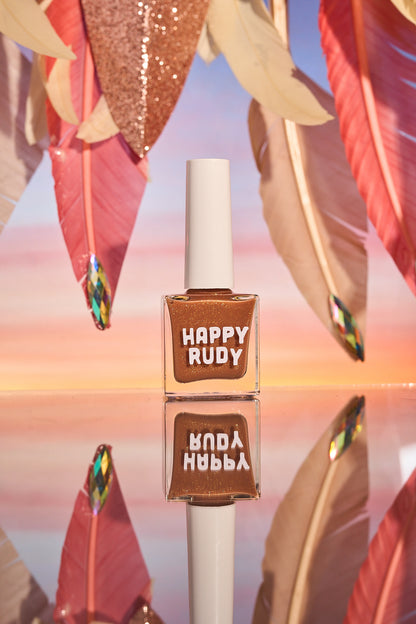 Caramel brown nail polish with gold eco-friendly glitter from the Masquerade Collection.